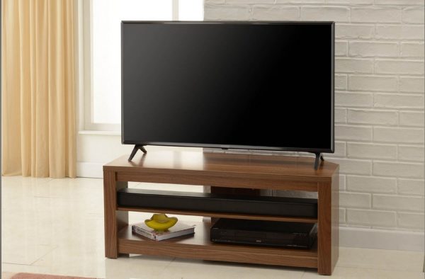 tv sitting on top of a TV stand which is wood